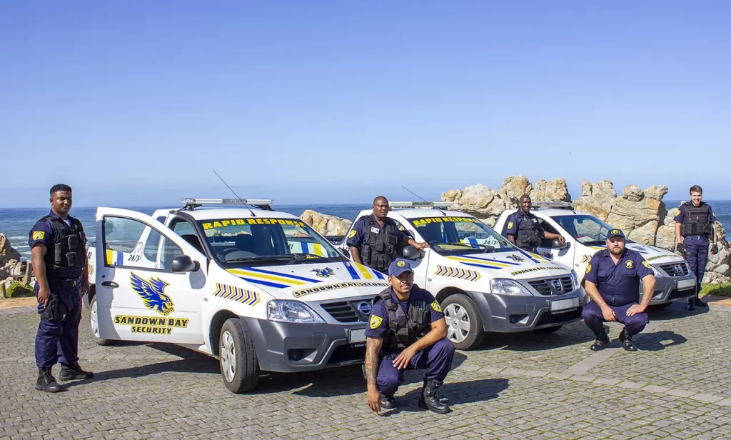 Rapid response unit posing with their vehicles