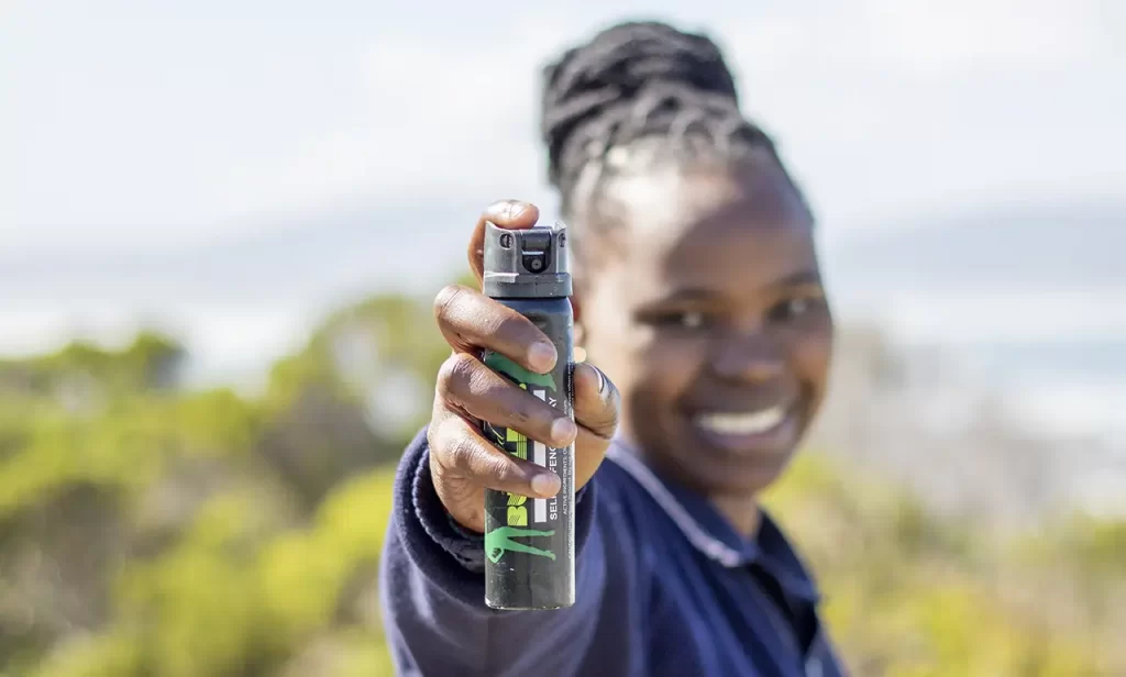 Guard woman with pepper spray ready