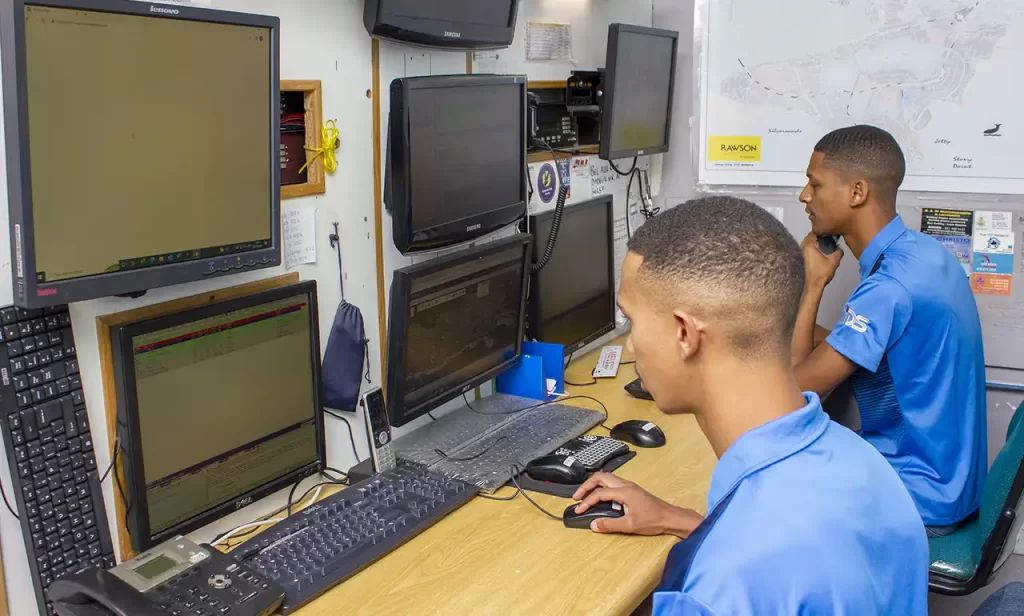 Two men monitoring security camera triggers