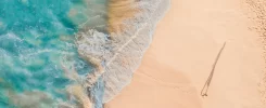 Person walking along the beach